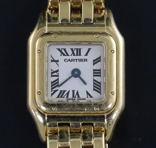 A ladys modern Cartier 18ct gold mini Panthere quartz wrist watch, with Cartier box and booklet.